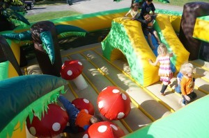 Kids play in rental bouncy house